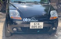 Chevrolet Spark MT 2010 - Cần bán gấp Chevrolet Spark MT sản xuất năm 2010, màu đen giá 98 triệu tại Tp.HCM