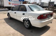 Mazda 323 MT 2000 - Bán Mazda 323 MT sản xuất 2000, màu trắng giá 75 triệu tại Tiền Giang