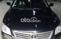Bán Toyota Camry 2.0E sản xuất năm 2009, màu đen, nhập khẩu nguyên chiếc  giá 400 triệu tại Tp.HCM