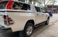 Cần bán lại xe Toyota Hilux 2.4E năm 2018, màu trắng, xe nhập số tự động giá 660 triệu tại Hà Nội