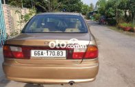 Mazda 323 2000 - Màu nâu chính chủ giá 115 triệu tại Đồng Tháp