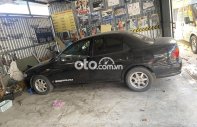 Mazda 323 1999 - Màu đen giá 87 triệu tại Bình Định