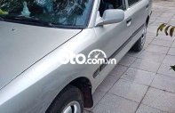 Mazda 323 1995 - Cần bán lại xe màu bạc giá 35 triệu tại Bình Dương