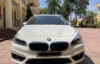 BMW 218i 2015 - Màu trắng, xe gia đình giá 620 triệu tại Hà Nội