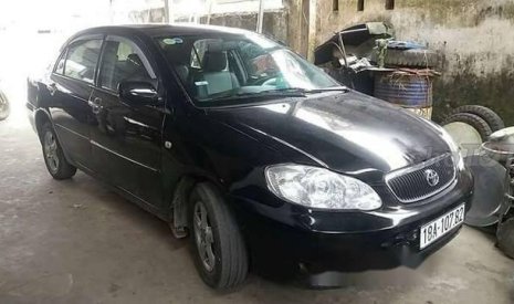 Toyota Corolla 2003 - Cần bán lại xe Toyota Corolla năm sản xuất 2003, màu đen chính chủ, 200tr