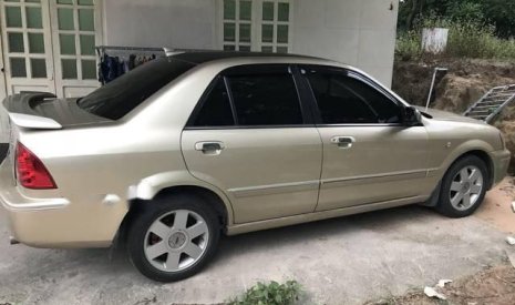 Ford Laser   2003 - Cần bán lại xe Ford Laser đời 2003, màu vàng xe gia đình, giá chỉ 180 triệu