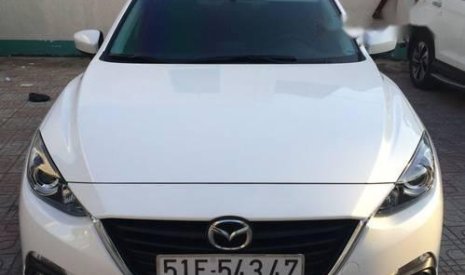 Mazda 3   2015 - Cần bán gấp Mazda 3 sản xuất 2015, màu trắng ít sử dụng, 600 triệu