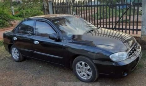 Kia Spectra 2003 - Cần bán Kia Spectra đời 2003, màu đen